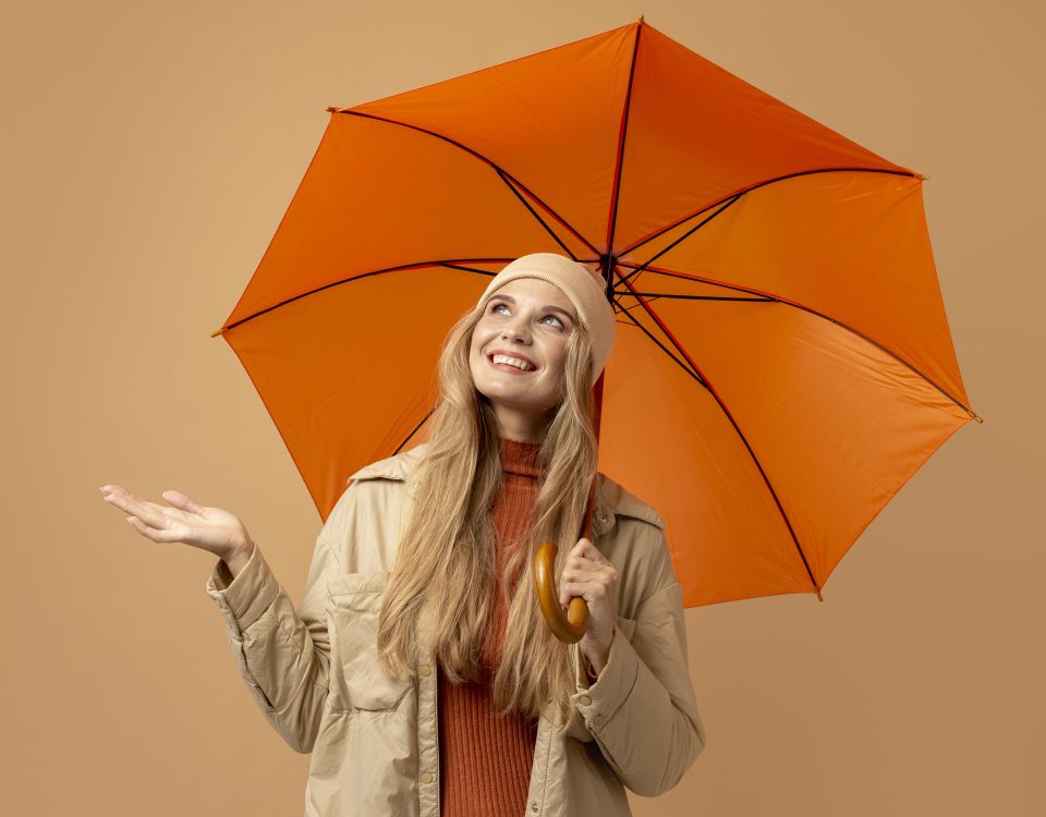 Woman shielded by umbrella