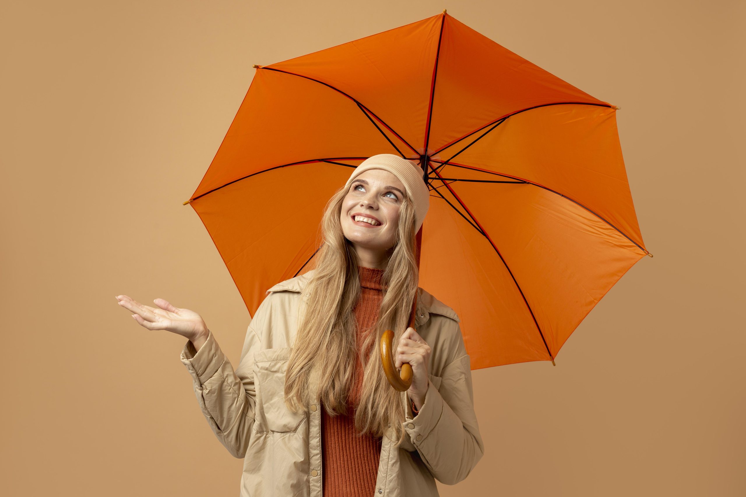 Woman shielded by umbrella