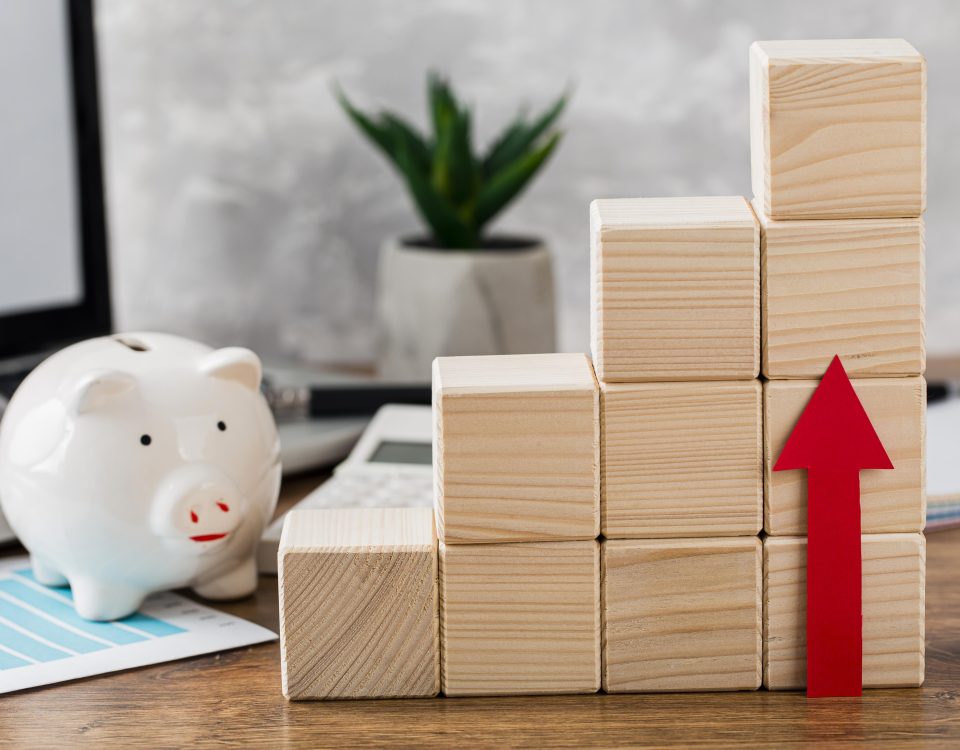 Stacked wooden blocks denoting money increase